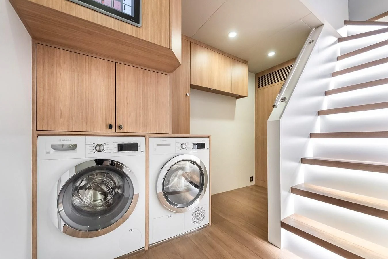a room with a bed and dryer and a staircase aboard PROJECT 105 Yacht for Sale