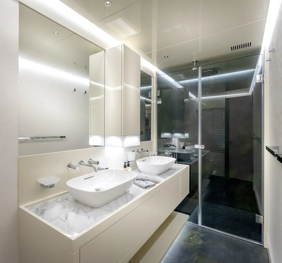 a bathroom with sinks and mirrors aboard PROJECT 105 Yacht for Sale