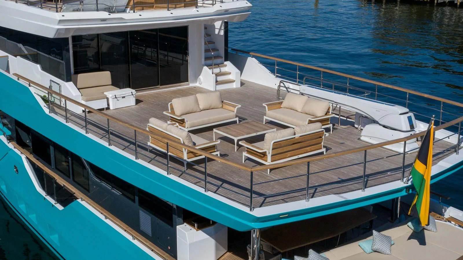a deck with a couch and a pool aboard PROJECT 105 Yacht for Sale