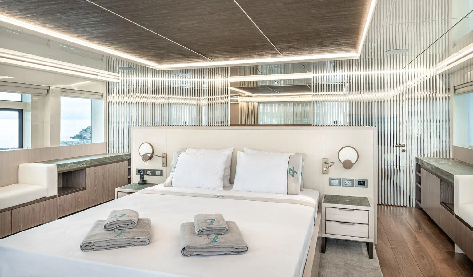 a large white bed with a white sheet and a white pillow on it aboard PROJECT 105 Yacht for Sale