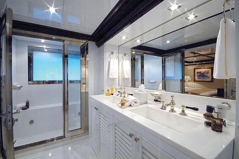 a bathroom with a large mirror aboard OXYGEN Yacht for Sale