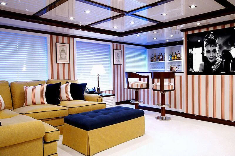 a living room with a large mirror aboard OXYGEN Yacht for Sale