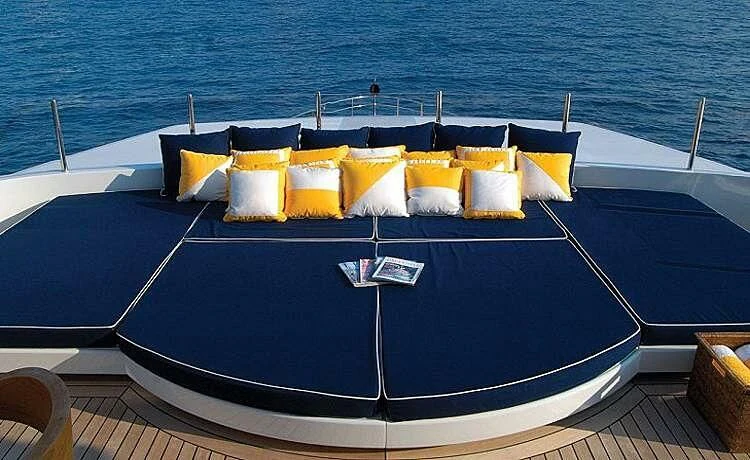 a boat with yellow pillows aboard OXYGEN Yacht for Sale