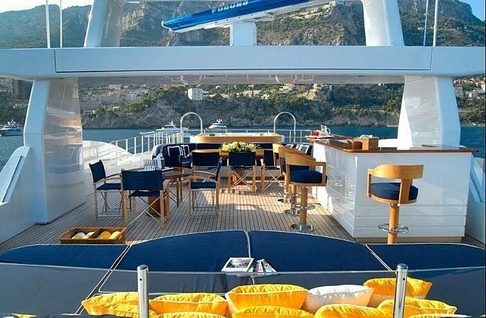 a room with a table and chairs aboard OXYGEN Yacht for Sale