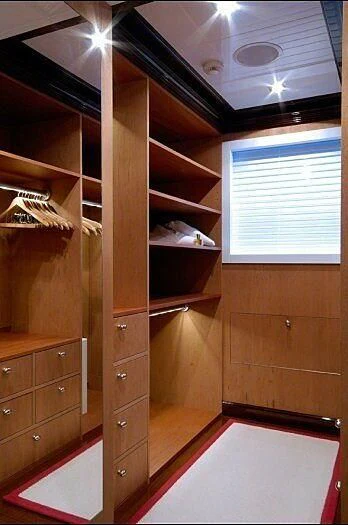 a room with a closet and a window aboard OXYGEN Yacht for Sale