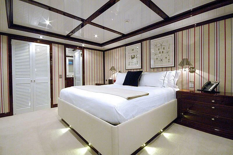 a large bedroom with a large bed aboard OXYGEN Yacht for Sale