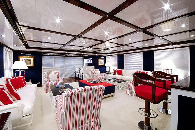 a room with a couch and a table and chairs aboard OXYGEN Yacht for Sale