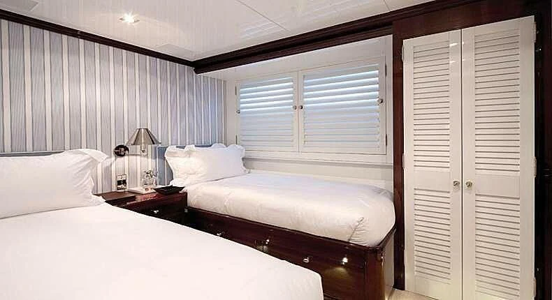 a room with two beds aboard OXYGEN Yacht for Sale