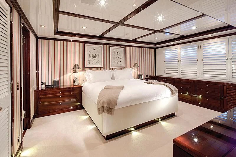 a room with a bed and a desk aboard OXYGEN Yacht for Sale