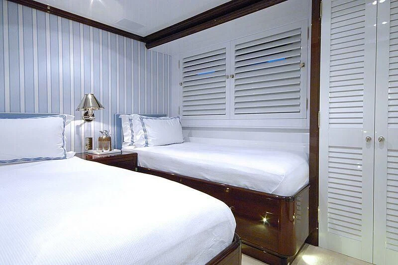 a couple of beds in a room aboard OXYGEN Yacht for Sale