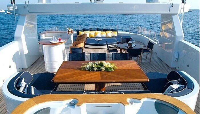 a table with a large potted plant on it aboard OXYGEN Yacht for Sale