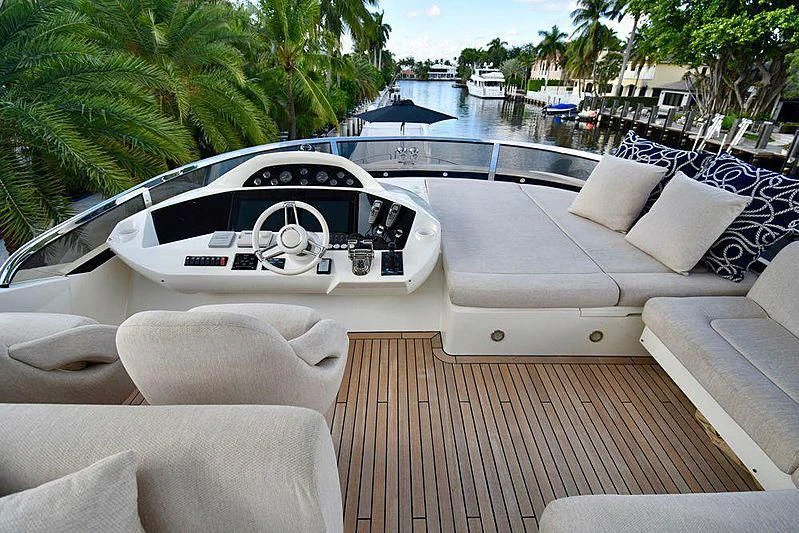 a white car on a deck aboard FULL CIRCLE Yacht for Sale