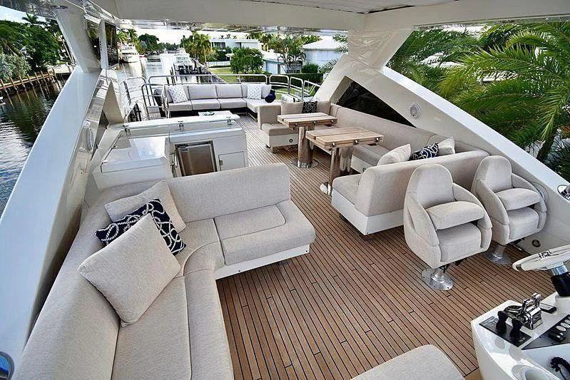 a living room with a couch and a table aboard FULL CIRCLE Yacht for Sale
