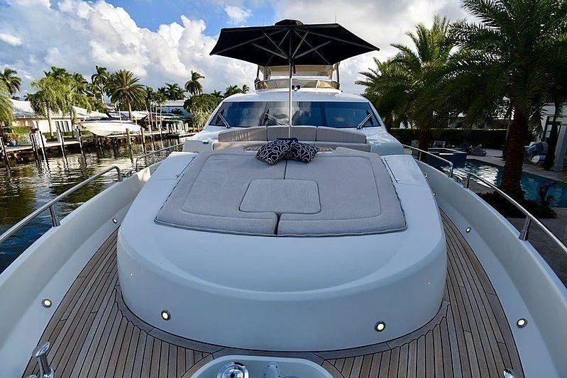 a white car with an umbrella on top of it aboard FULL CIRCLE Yacht for Sale
