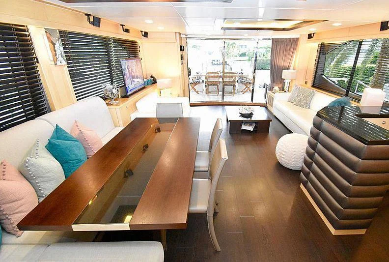 a room with a couch and a table and a window aboard FULL CIRCLE Yacht for Sale
