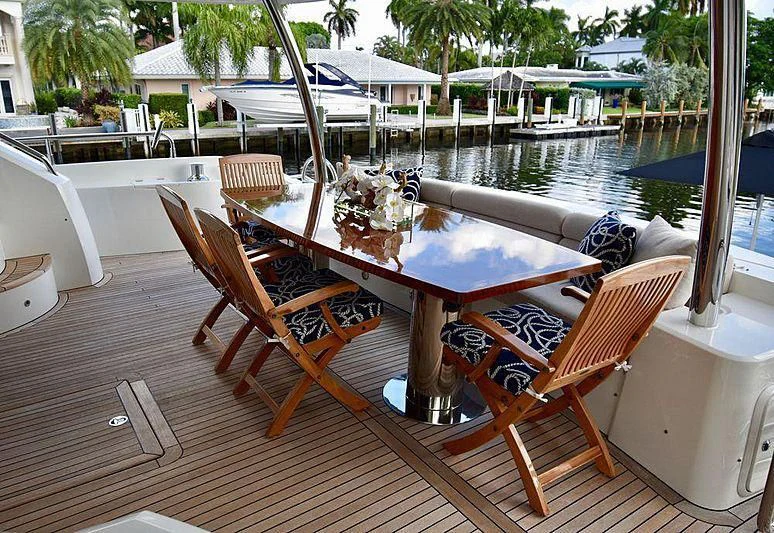 a table with chairs on it aboard FULL CIRCLE Yacht for Sale