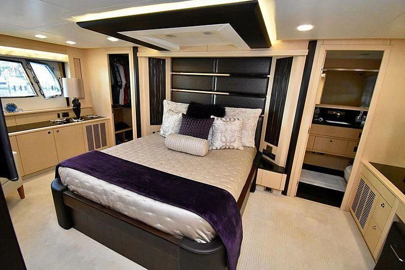 a large bedroom with a large bed aboard FULL CIRCLE Yacht for Sale