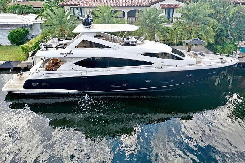 a white yacht in a body of water aboard FULL CIRCLE Yacht for Sale