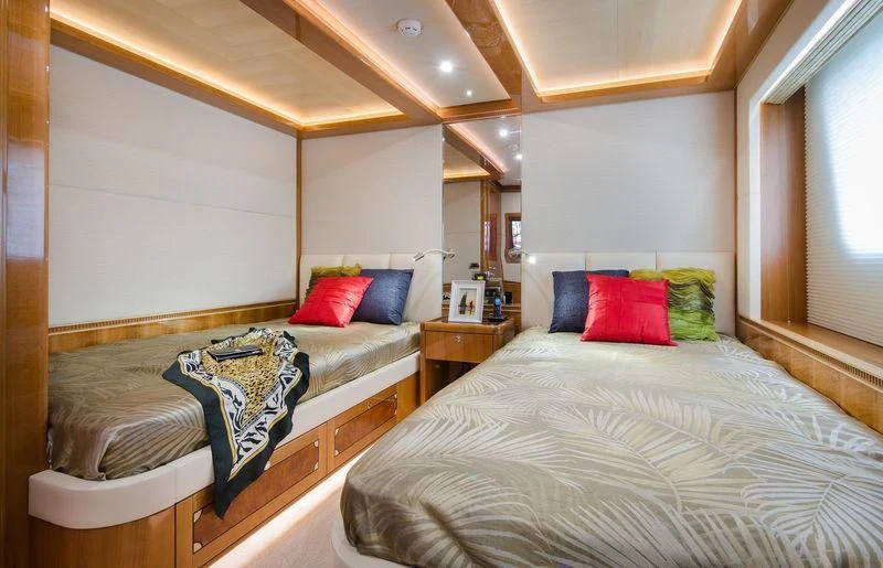 a couple of beds in a hotel room aboard OBSESSION Yacht for Sale
