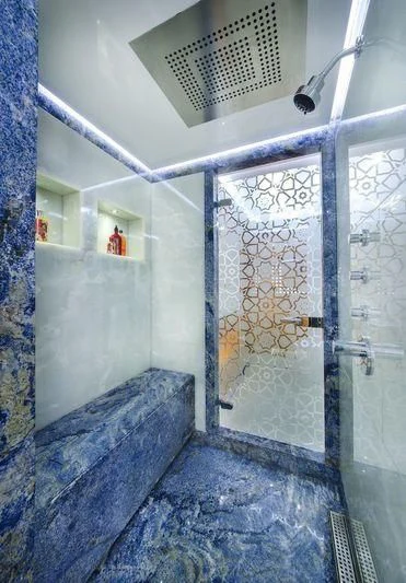 a room with a bed and a door aboard OBSESSION Yacht for Sale