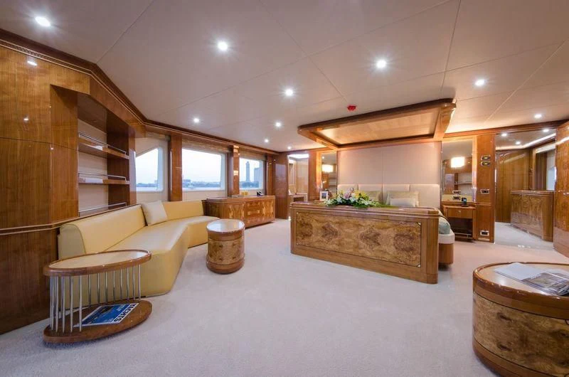 a large room with a couch and a table aboard OBSESSION Yacht for Sale