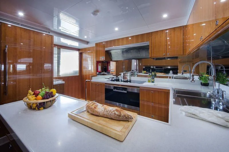 a kitchen with a large island aboard OBSESSION Yacht for Sale
