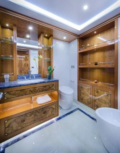 a bathroom with a large mirror aboard OBSESSION Yacht for Sale