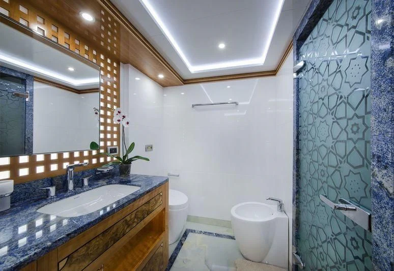 a bathroom with a sink and a toilet aboard OBSESSION Yacht for Sale