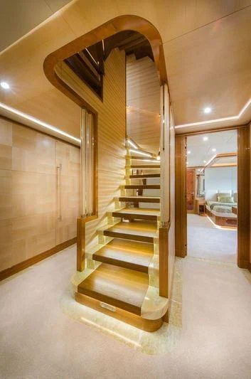 a staircase in a building aboard OBSESSION Yacht for Sale