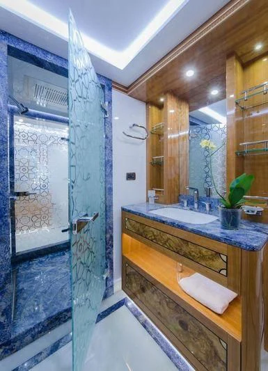 a bathroom with a sink and a shower aboard OBSESSION Yacht for Sale