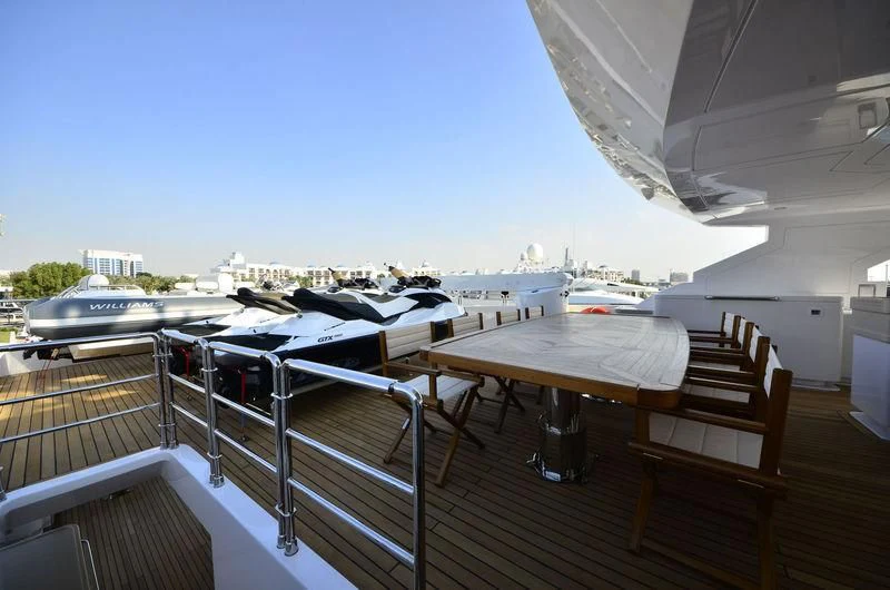 a deck with a view of the water and boats aboard OBSESSION Yacht for Sale