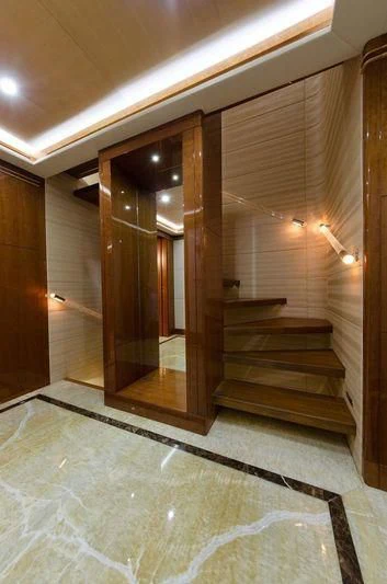 a hallway with a glass door aboard OBSESSION Yacht for Sale
