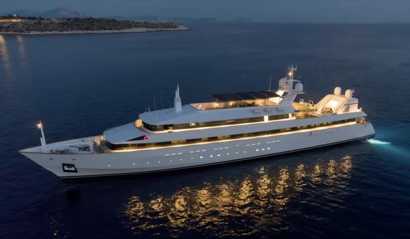 a white yacht on the water aboard ADAMAS V Yacht for Sale