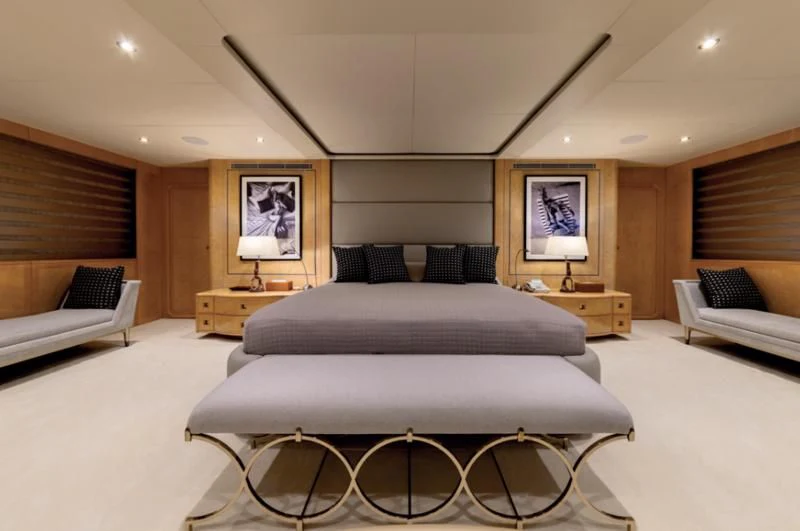 a large bedroom with a large bed aboard ADAMAS V Yacht for Sale