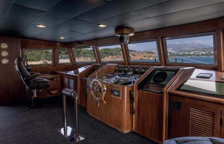 a room with a desk and chairs aboard ADAMAS V Yacht for Sale