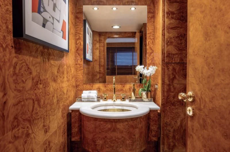 a bathroom with a sink and a mirror aboard ADAMAS V Yacht for Sale