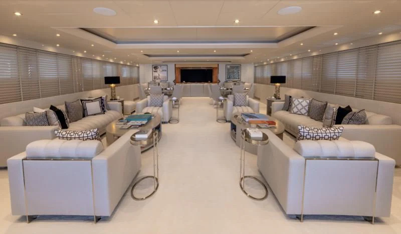 a large room with a couch and a table aboard ADAMAS V Yacht for Sale