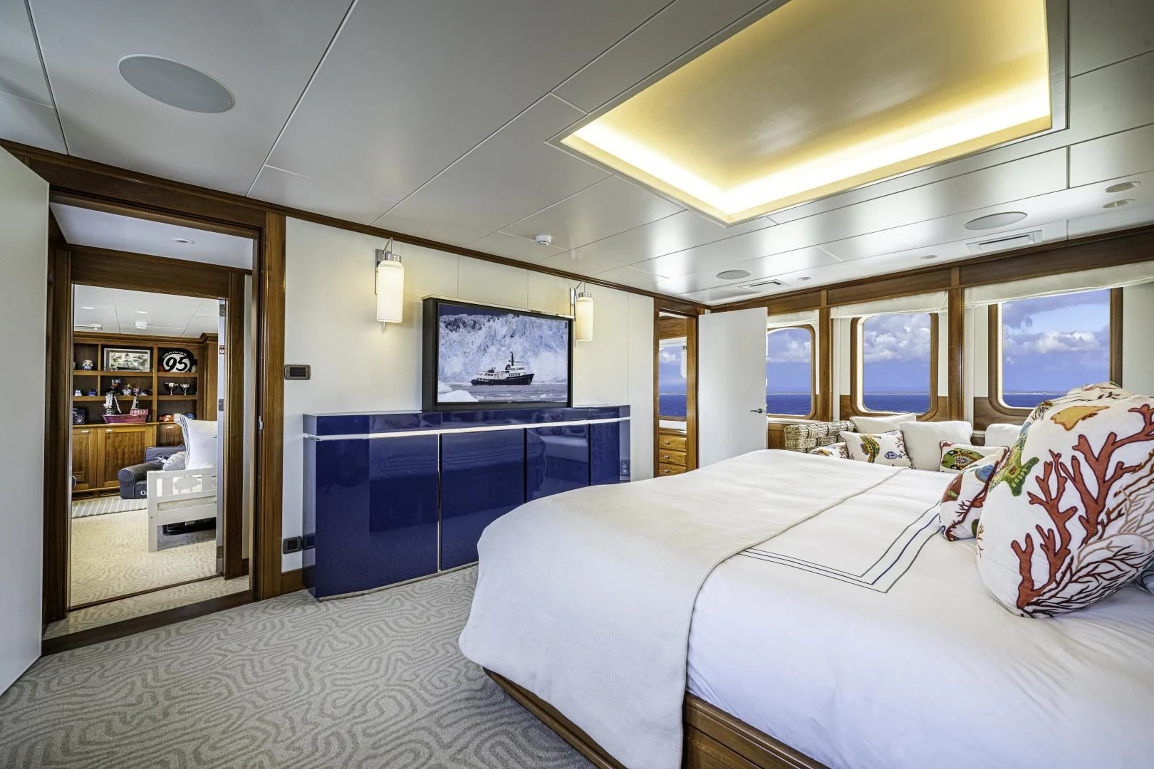 a room with a bed and a tv aboard ASTERIA Yacht for Charter