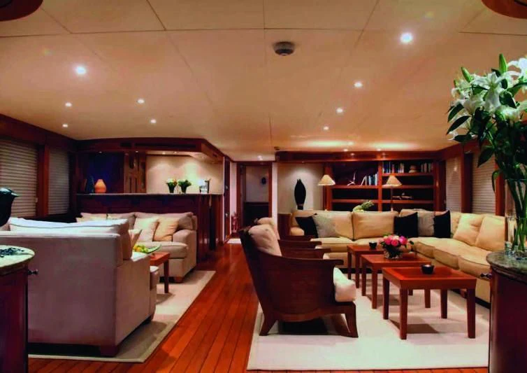 a living room with a large kitchen and dining area aboard ASTERIA Yacht for Charter