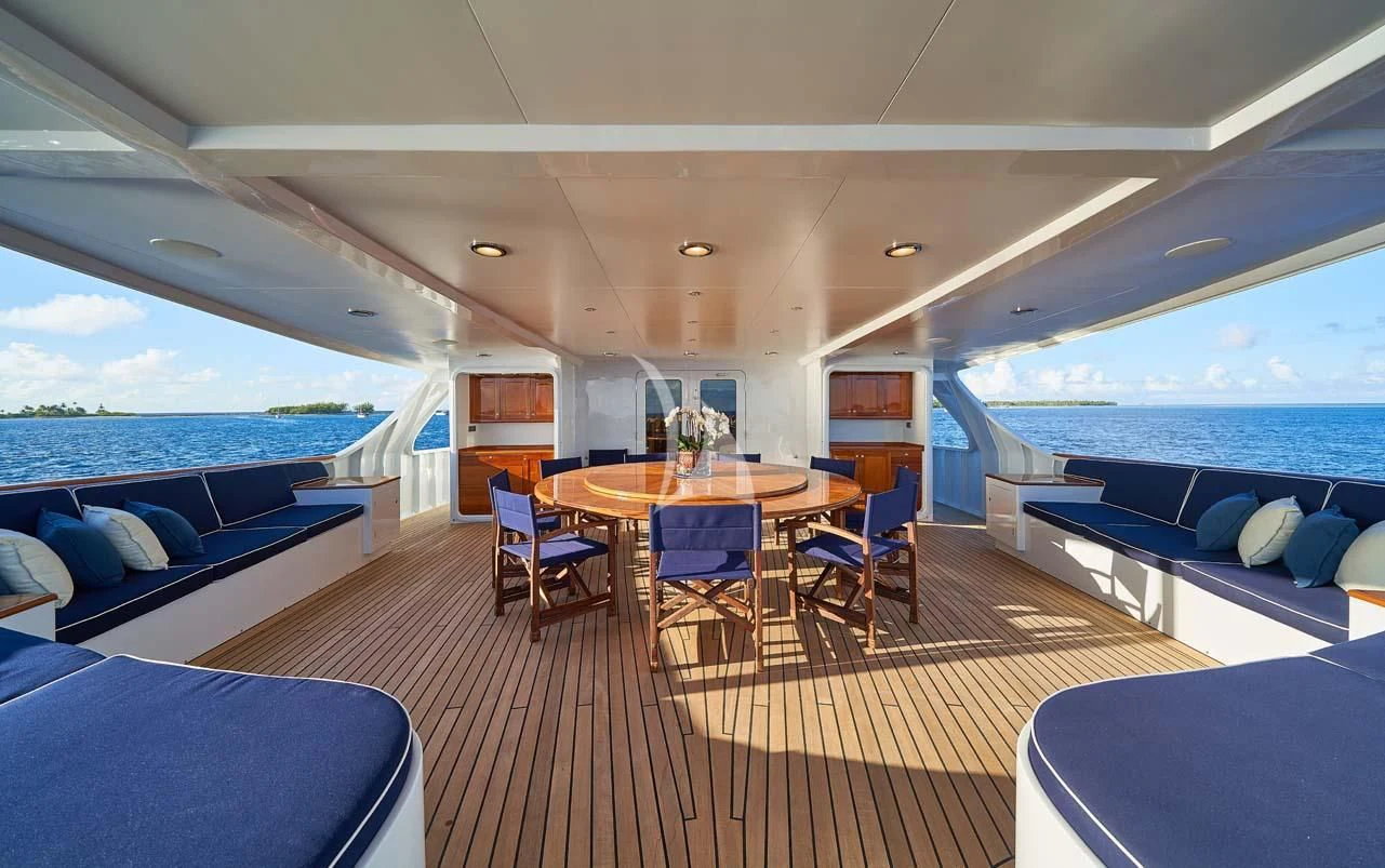 a boat with a table and chairs aboard ASTERIA Yacht for Charter