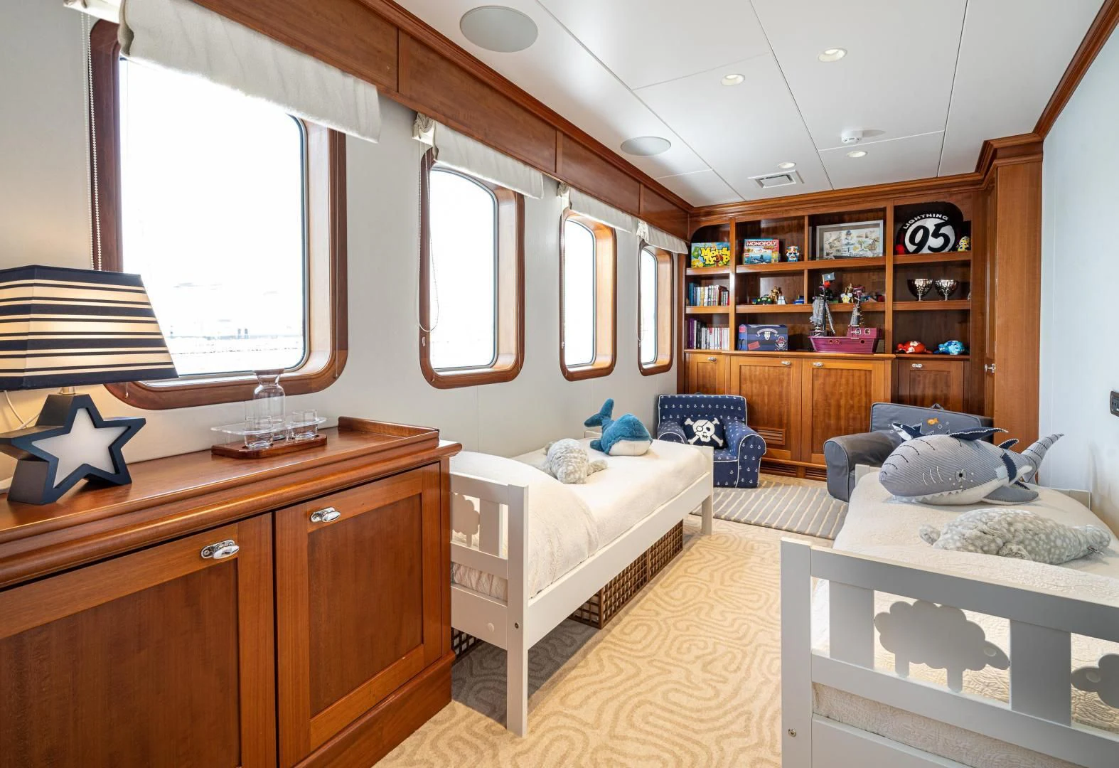 a bedroom with a bed and a desk aboard ASTERIA Yacht for Charter
