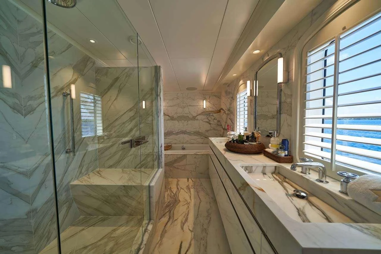 a bathroom with a large glass shower aboard ASTERIA Yacht for Charter