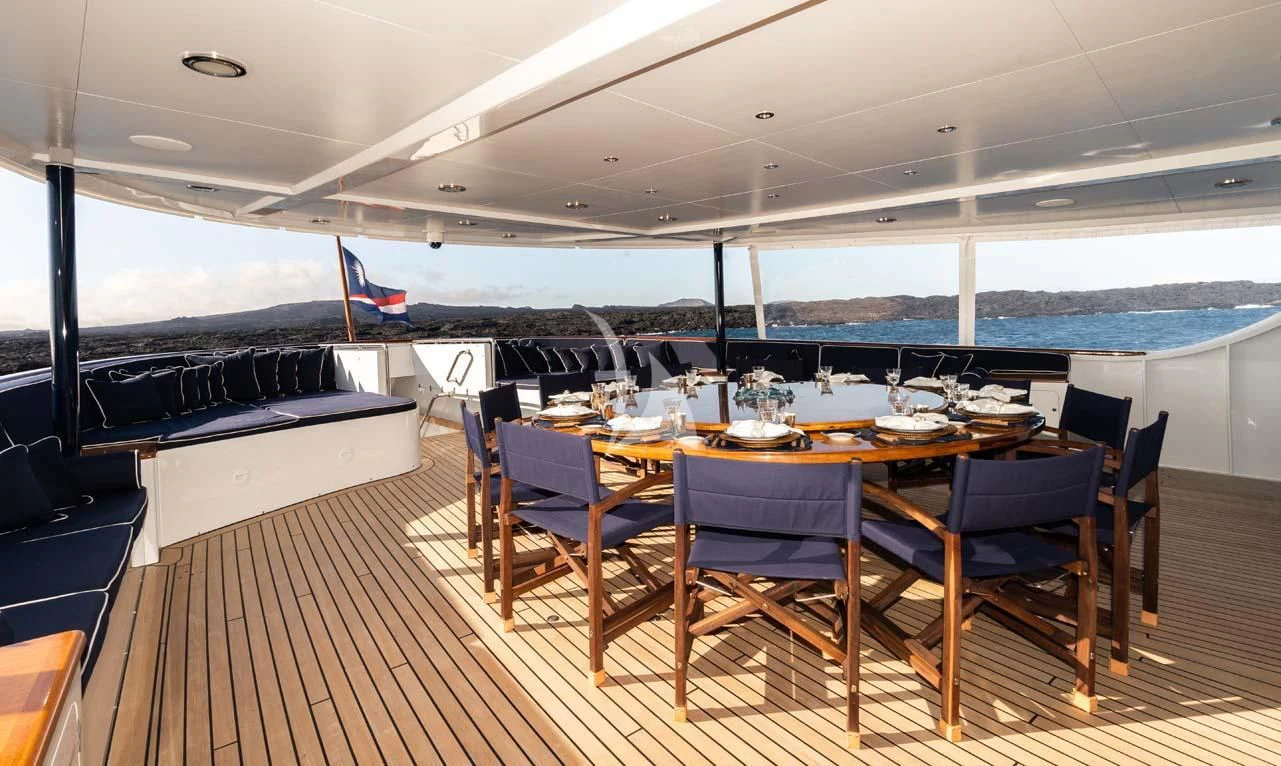 a room with a table and chairs aboard ASTERIA Yacht for Charter