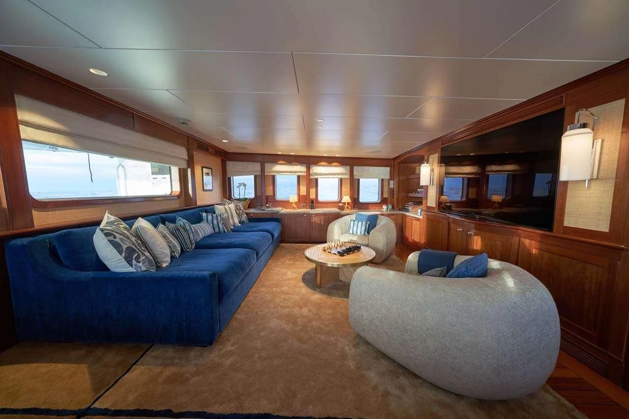 a living room with a couch and a coffee table aboard ASTERIA Yacht for Charter