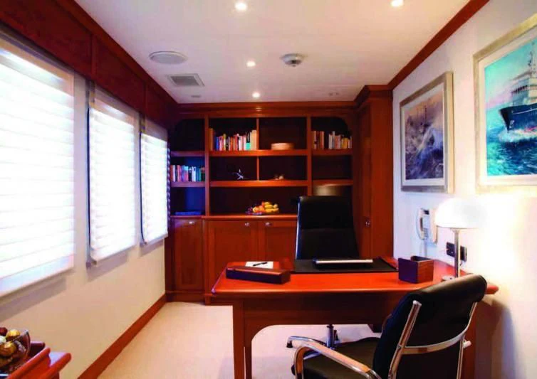 a room with a desk and a computer aboard ASTERIA Yacht for Charter