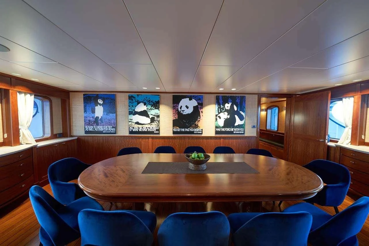 a room with a table and chairs aboard ASTERIA Yacht for Charter