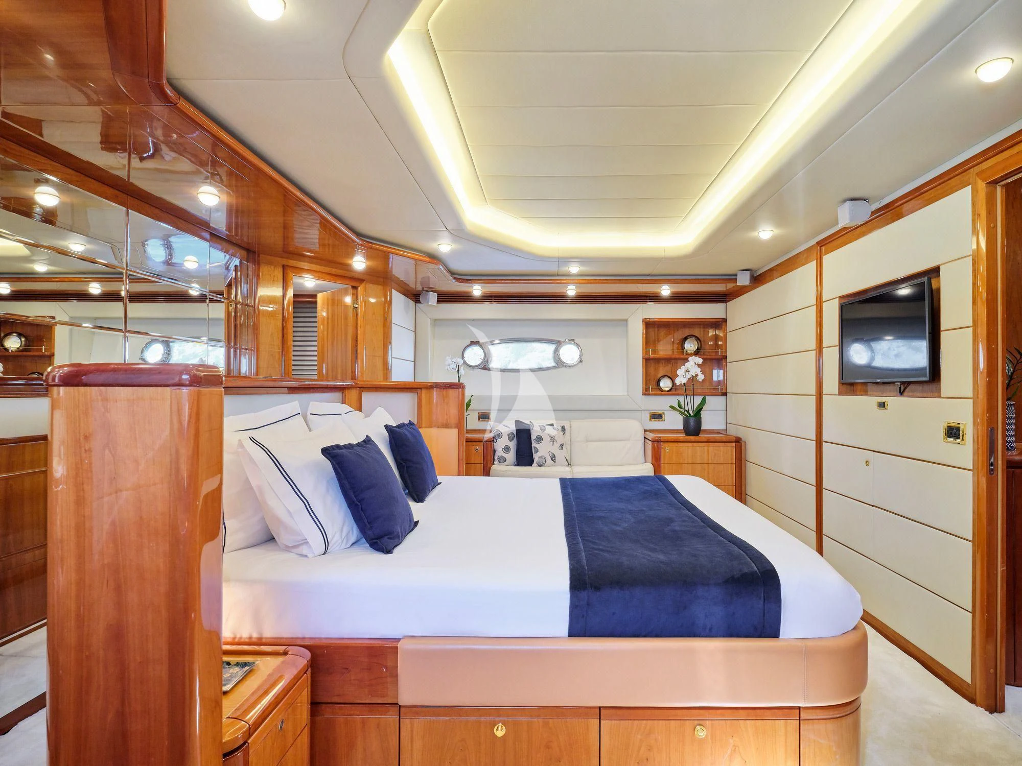 a bedroom with a bed and a television aboard ESTIA YI Yacht for Sale