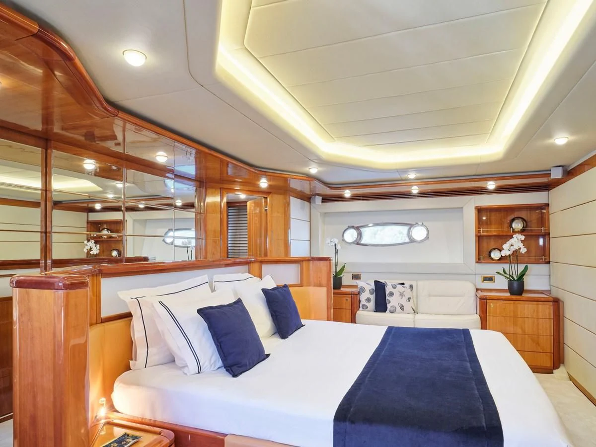 a bedroom with a large bed aboard ESTIA YI Yacht for Sale