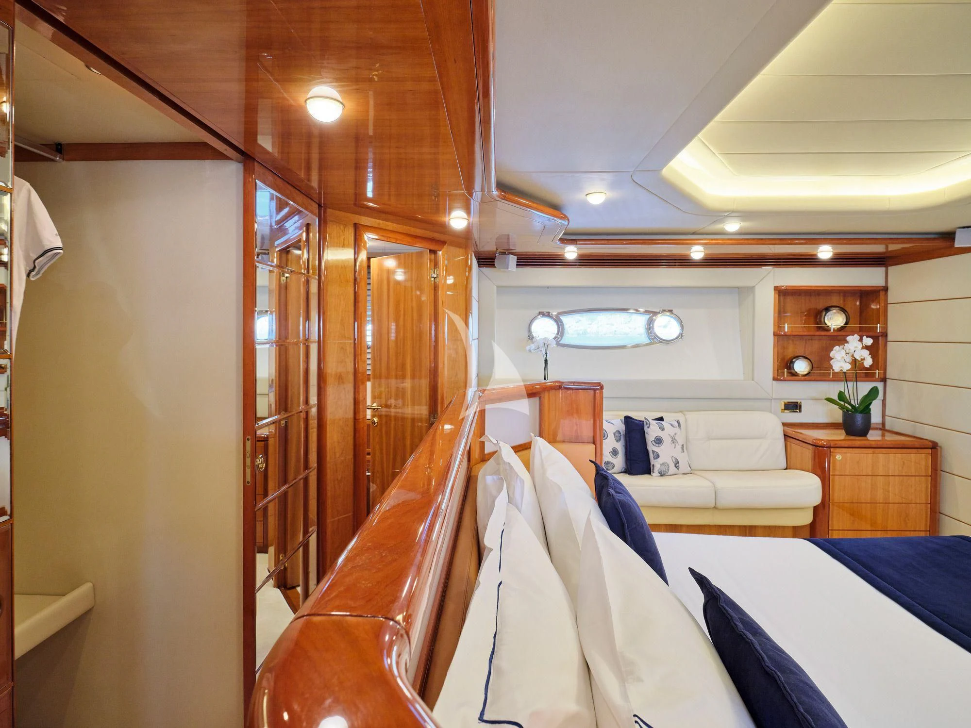 a room with a bed and a chair aboard ESTIA YI Yacht for Sale