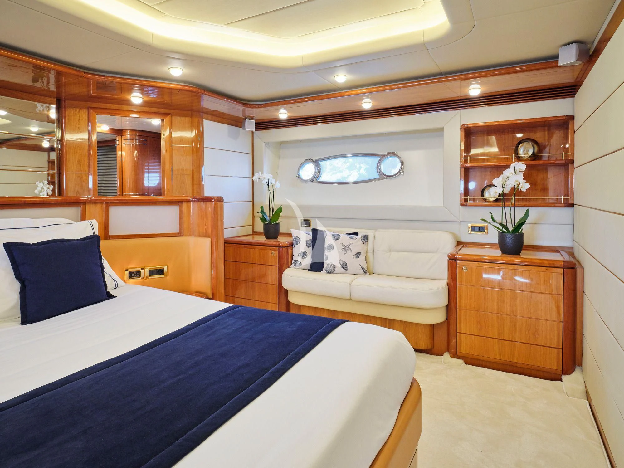 a bedroom with a bed and a couch aboard ESTIA YI Yacht for Sale